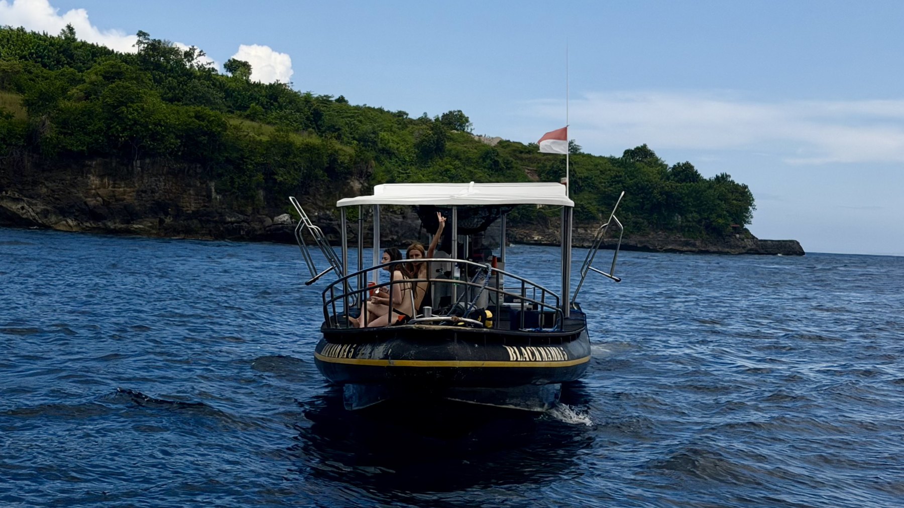 Fishing charter boat off a tropical coast
